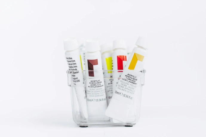 white and yellow plastic tube bottles